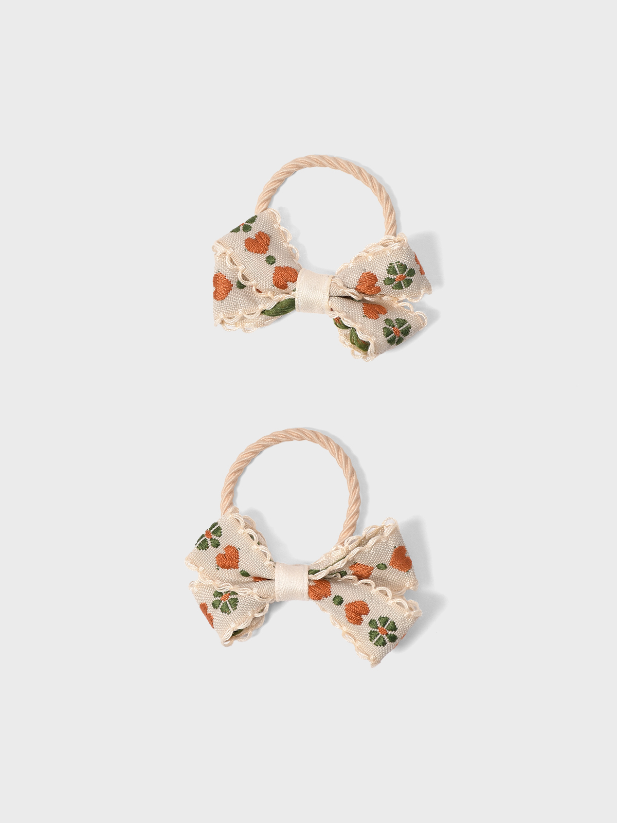 Резинка для волос бантик бежевый Tais 359₽