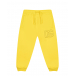 Желтые спортивные брюки с лого в тон Dolce&Gabbana | Фото 1