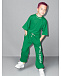 Зеленые спортивные брюки с белым логотипом  | Фото 2