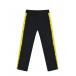 Черные спортивные брюки с желтыми лампасами Moschino | Фото 1