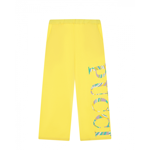 Желтые спортивные брюки с разноцветным лого  | Фото 1
