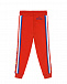 Красные спортивные брюки с разноцветными лампасами  | Фото 3